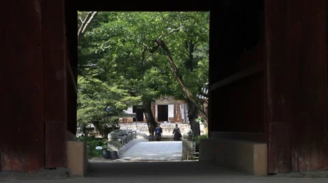 Temple view with people through open door Stock Footage 27976765