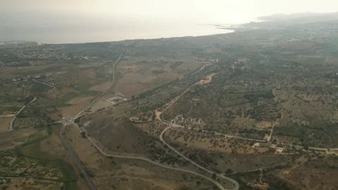 Temples of Agrigento with Mediterranean Sea - Circle-Left-Zoom-Out-Clip Stock Footage 250364067