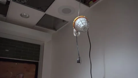 Temporary construction lighting in room with exposed ceiling 動画素材 314030698