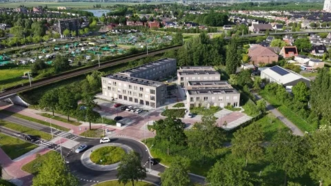 Temporary housing apartment complex near roundabout and railway Video stock 335990165