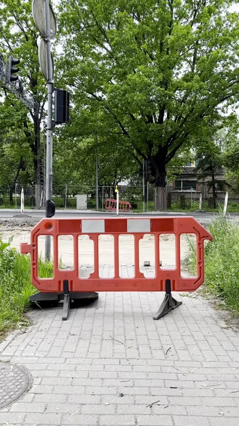 Temporary Safety Barrier Blocking Sidewalk at Urban Intersection Stock Footage 341569284