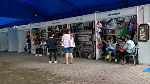 Temporary Shoes Bazaar In The Middle of a Park Stock Footage 221556146