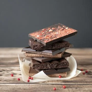 Tempting display of chocolate bars adorned with dried strawberries Stock Photos