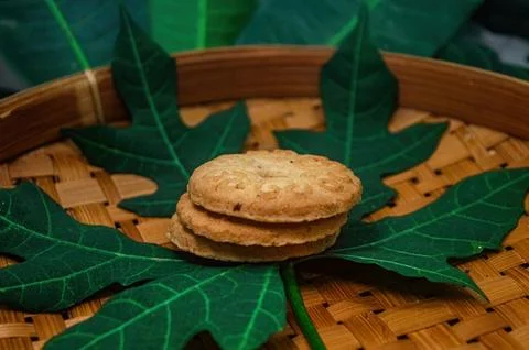 A tempting stack of golden brown round biscuits, beautifully presented on a.. Foto stock