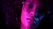 Tempting Woman With Perfect Make-Up And Transparent Glasses Posing In Dark Room Stock Footage