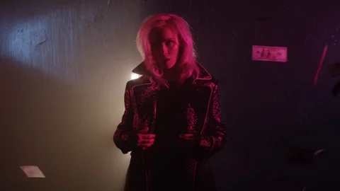 Tempting young woman is posing in darkness, dollars banknotes are flying around Stock Footage 101551553