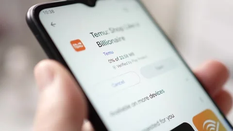 Temu Shopping App Downloading on a Smartphone Screen Closeup Stock Footage 247522014