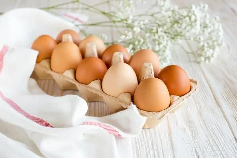 Ten brown eggs Stock Photos