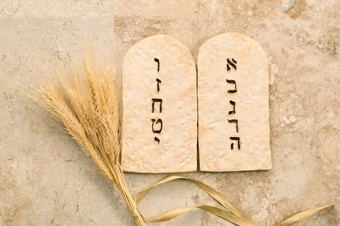 Ten commandments stone tablets with wheat for shavuot Stock Photos