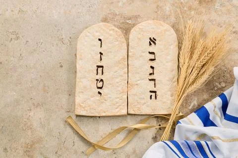 Ten commandments tablets with wheat and tallit celebrating shavuot Stock Photos
