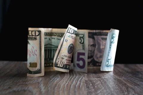 Ten dollars and five on the table 写真素材