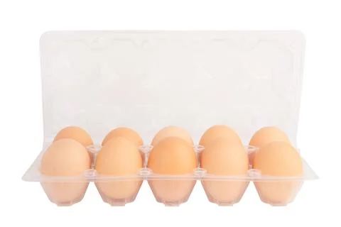 Ten eggs in a plastic tray isolated on a white background Stock Photos