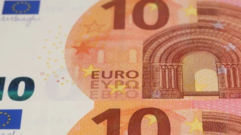 Ten Euro notes close up tracking. Euro money cash. Dolly shot, low angle. 4K Stock Footage 125529664