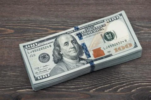 Ten thousand American dollars. a bundle of banknotes on the background of a Stock Photos