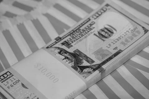 Ten Thousand Dollars Stack in hundreds on Red &amp; White Striped Background (B&amp;W Stock Photos