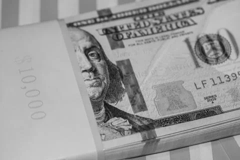 Ten Thousand Dollars Stack in hundreds on Red &amp; White Striped Background (B&amp;W Stock Photos