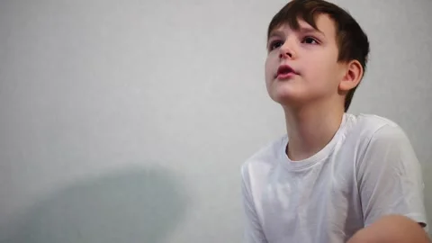 Ten year old boy playing console on TV. Face turned to the side Stock-Footage 297553215