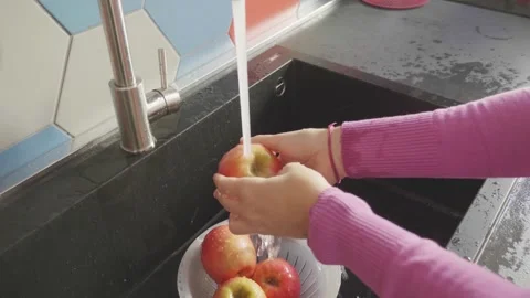 Tender Care: Hands Lovingly Cleanse a Crisp Apple Stock Footage 271299504