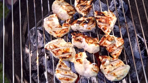 Tender chicken kebabs with herbs cooked over glowing coals Stock Footage 326022398
