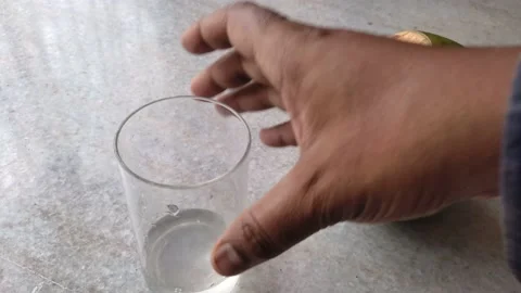 Tender coconut water being poured in a glass. Refreshing natural drink in sum 스톡 동영상 181027673