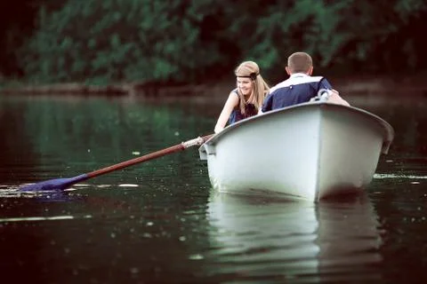Tender couple boating on lake Stock Photos