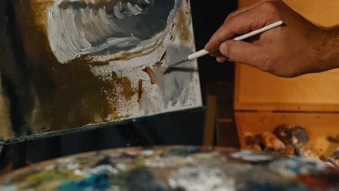 Tender cute man painter drawing at large easel Stock-Footage 146588796