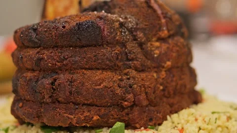 Tender grilled beef on bone, a culinary masterpiece. Experience the art of Stock Footage 273448538