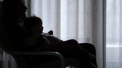 The tender image of a little girl while sleeping in the arms of her mother Stock Footage 130598978