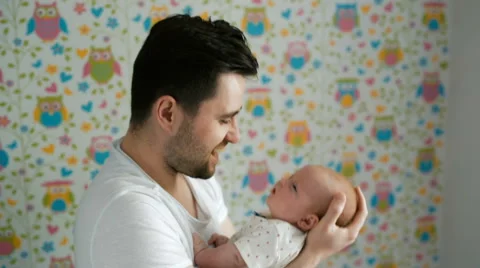 Tender moment between a father and newborn baby Stock-Footage 66446372