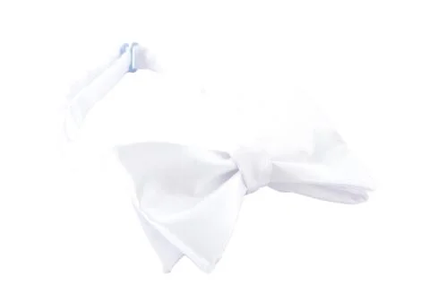 Tender white bow tie for an elegant suit Stock Photos
