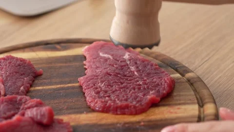 Tenderizing Beef Steaks on Board. Stock Footage 255251279