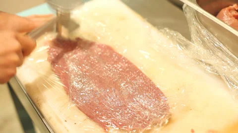 Tenderizing meat Stock Footage 36142613