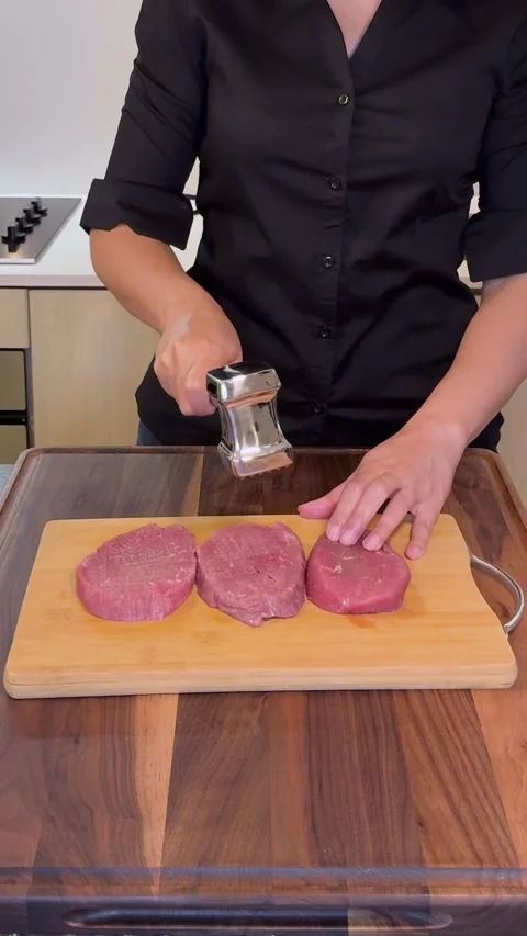 Tenderizing Raw Beef Steaks with Meat Mallet, Preparing Steak Texture Stock Footage 331074742