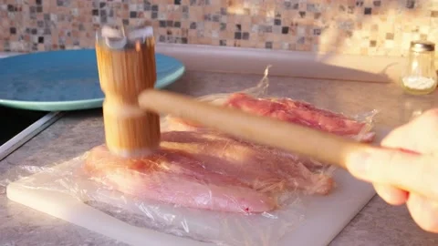 Tenderizing Raw Chicken Fillet With Kitchen Meat Hammer Stock Footage 328309410