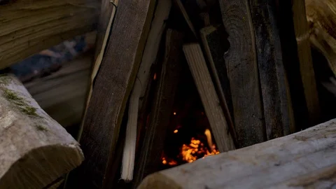Tending a Glowing Camp Fire  Stock-Footage 122333636