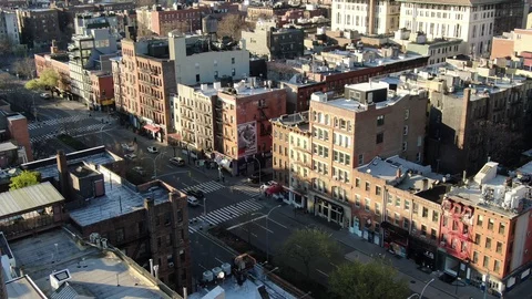 Tenement rooftops above a quiet Manhattan street corner Stock-Footage 127869064