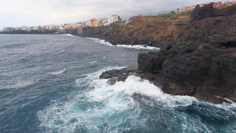 TENERIFE, SPAIN - MAY, 18, 2018: Aerial view Atlantic ocean coast and cliffs on Stock Footage 97828624