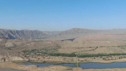 Tengger desert on a background of Yellow river Huang He, Shapotou district Stock Footage 218642640