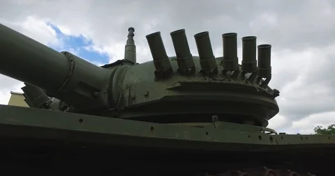 Tenk middle from low angle and blue cloudy sky Stock Footage 109534841