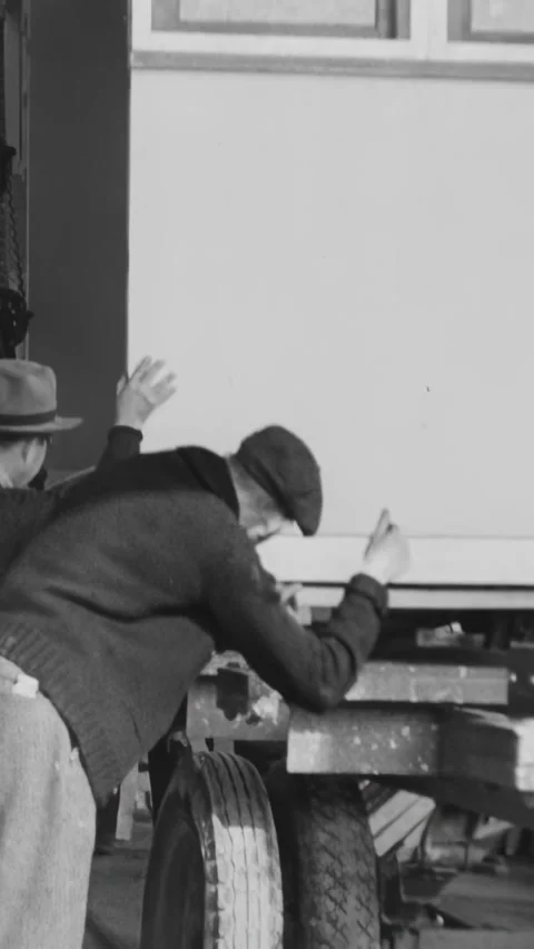 TENNESSEE - 1940s - Workers lower a kit house onto a flatbed truck. Stock Footage 340297923