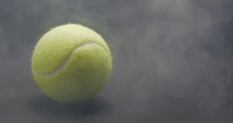 Tennis ball bouncing with smoke studio Stock Footage 242931001