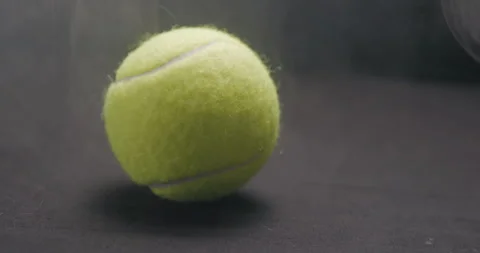Tennis ball bouncing with smoke studio Stock Footage 242931054