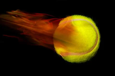 Tennis ball on fire. Stock Photos