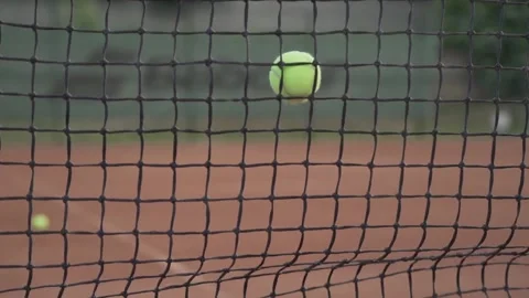Tennis ball hit the net (front view) Stock Footage