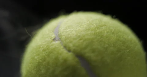 Tennis ball macro rotating with smoke in studio slow motion Video stock 281040053