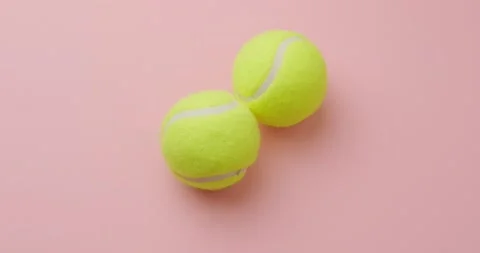 Tennis ball on pink background Stock Footage 146480581
