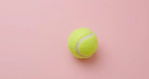 Tennis ball on pink background Stock Footage 146480787
