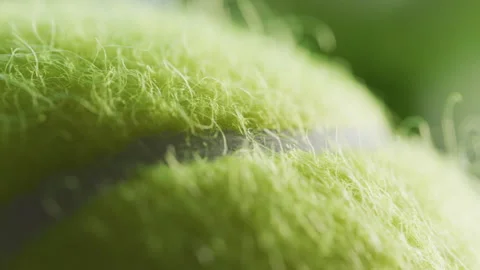 Tennis ball rotating macro Stock Footage 131806083