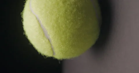 Tennis ball rotating studio rotating, vertical Video stock 242930579
