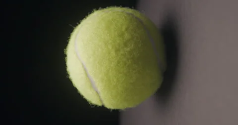 Tennis ball rotating studio rotating, vertical Stock Footage 242930615